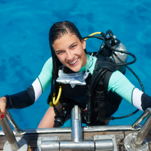 A woman climbing out of the water