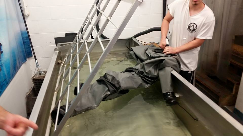 Repairman working on a drysuit