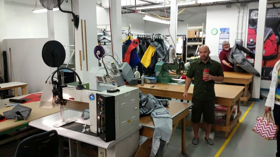 Drysuit repair shop with workers present