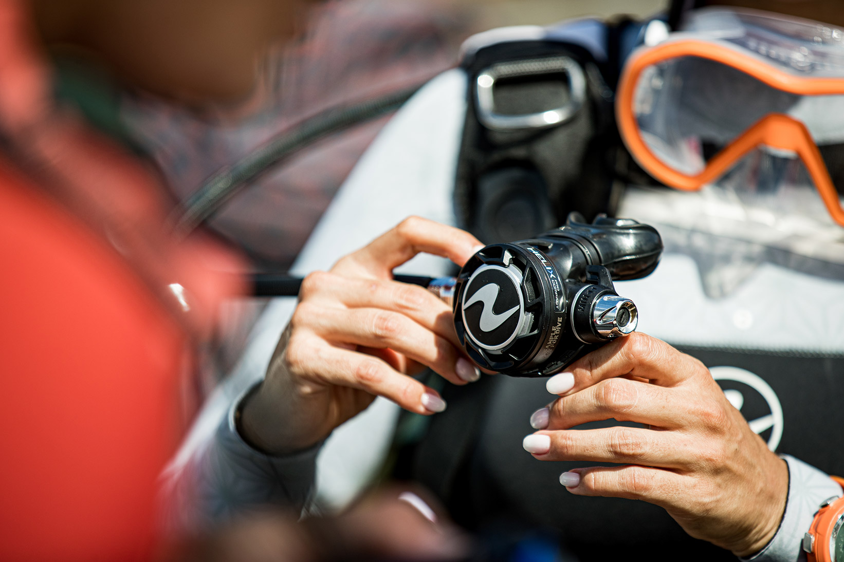 Regulator being held in a diver's hand