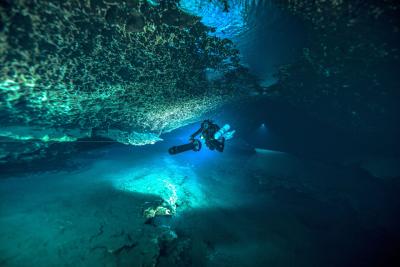 Technical diver underwater exploring the depths