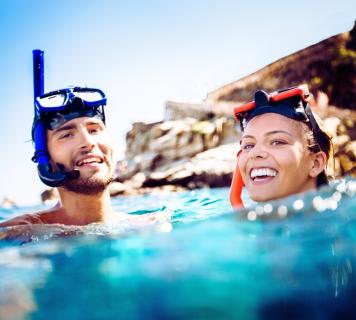 A couple happily snorkeling