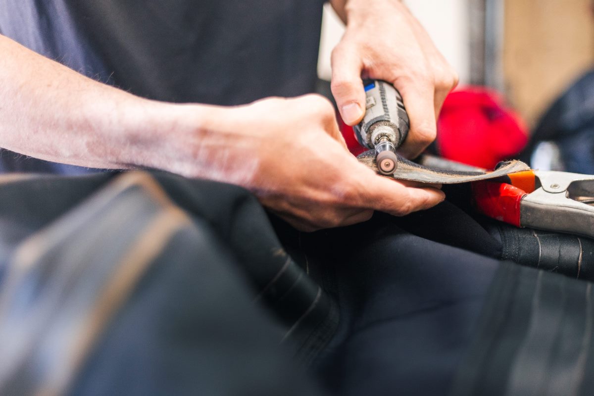 Repair technician performing scuba gear servicing