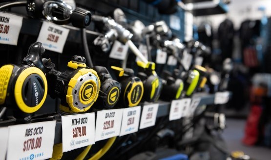 A selection of dive octos on display for sale at a dive shop